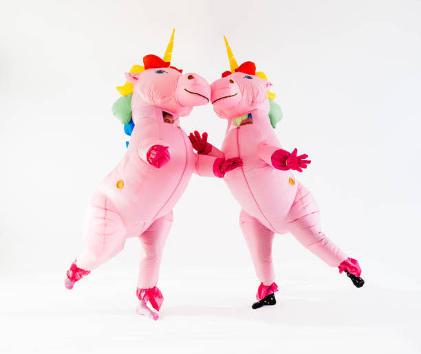 istock Two inflatable unicorns adorned in gay pride rainbow colors dancing 2045185321