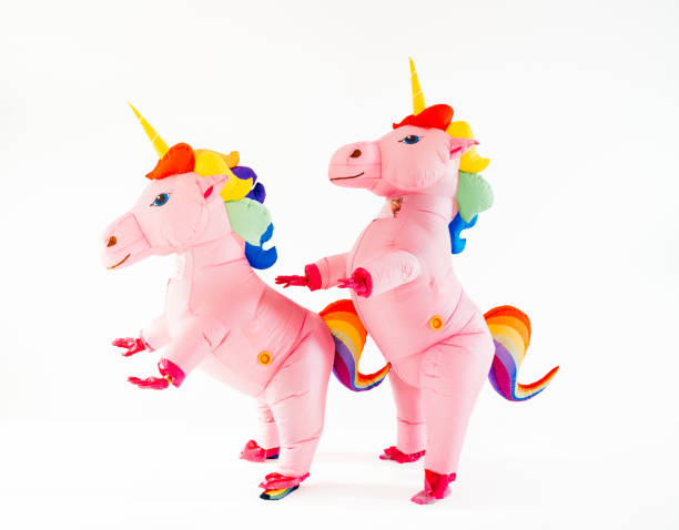 istock Two pink unicorns with rainbow manes standing together 2045185844