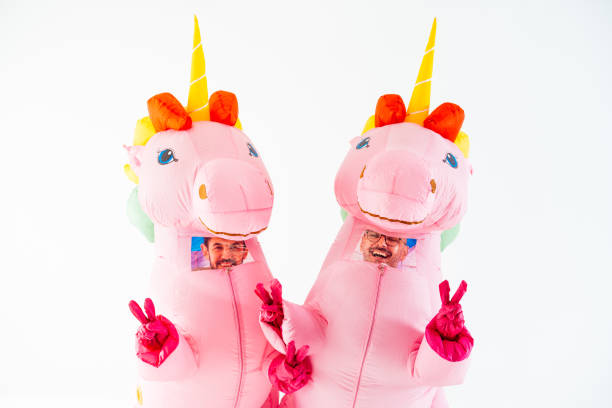 istock Pink unicorn inflatable costumes with V sign 2045186436
