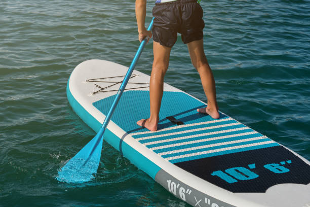 istock Faceless child on paddleboard in sea 2045191701