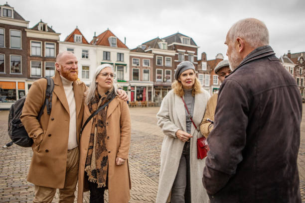 istock Two middle aged diverse couples on staycation in Delft with a tour guide 2045200852