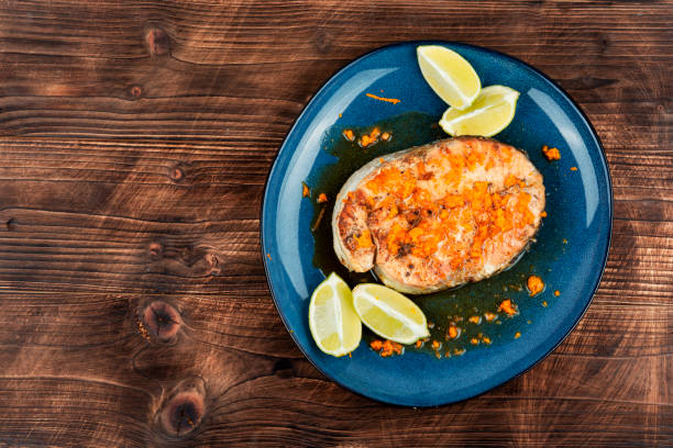 istock Salmon or trout steak in orange marinade. 2045241553
