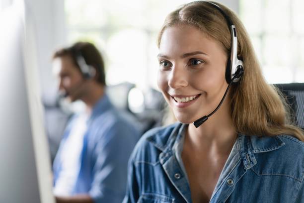 istock Young friendly operator woman agent with headsets working in a call center. 2045252339