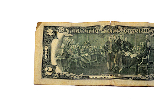 The reverse side of 2 two dollars bill banknote series 1976 with Trumbull's declaration of independence, old American money banknote, vintage retro, United States of America, selective focus