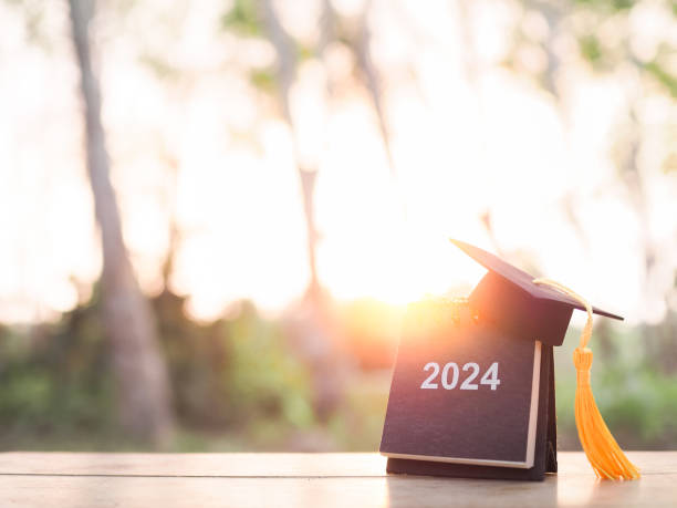 istock Study goals, 2024 Desk calendar with graduation hat. The concept for Resolution, Goal, Action, Planning, and manage time to success graduate. 2045276942