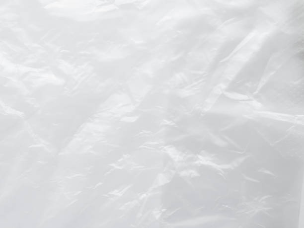 istock Plastic Paper Foil Silver Crumpled Wrap Film Cellophane White Background Package Pattern Sheese Bag Pvc Frame Stretch Tape Round Clean, Moden Packaging Polythene Surface Mockup Eco Environment. 2045295507