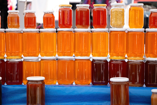 Pile of honey jars at street market