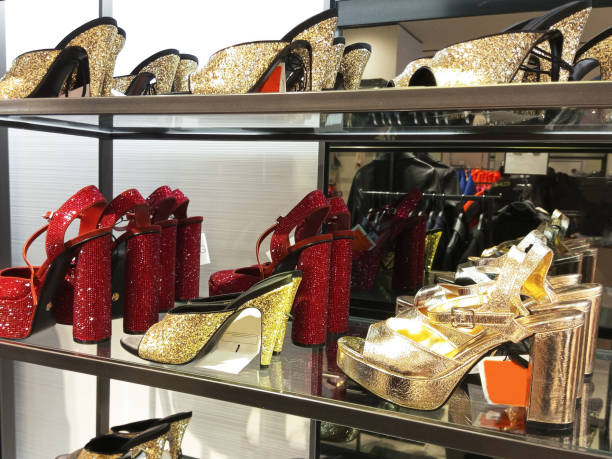 istock Shiny evening shoes with sequins on a store window. 2045312940