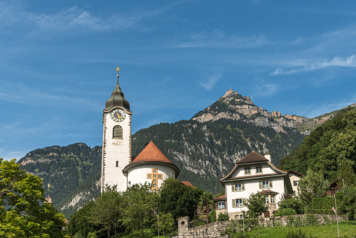 Fluelen, Canton of Uri, Switzerland - August 18, 2023. Parish church in Fluelen on Lake Lucerne