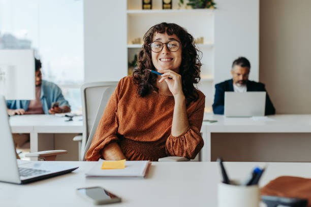 istock Happy businesswoman planning project at office table 2045382337