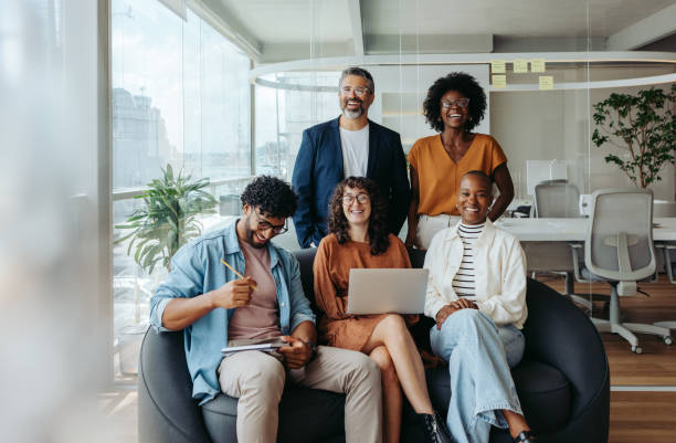 istock Diverse team of professionals collaborating in a modern office environment 2045383956