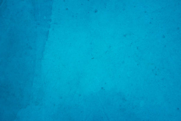 Dark blue concrete stone texture for background in summer wallpaper. Cement and sand wall of tone vintage minimal. Concrete abstract wall of light cyan color, cement texture mint green for design.