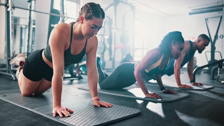 Teamwork, gym class and push ups for exercise, training and core muscle strength for healthy body. Wellness, workout and power for performance, challenge and accountability club for commitment
