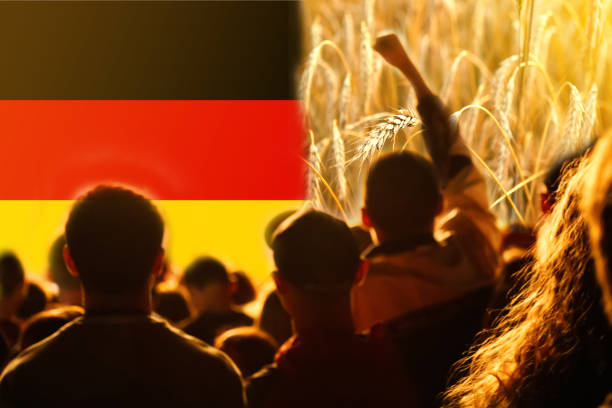 Farmers protest in Germany. Flag, wheat and people background.