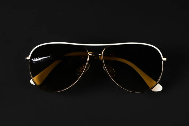 istock Black glasses with a classic frame on a dark background. Shallow depth of field 2045425864