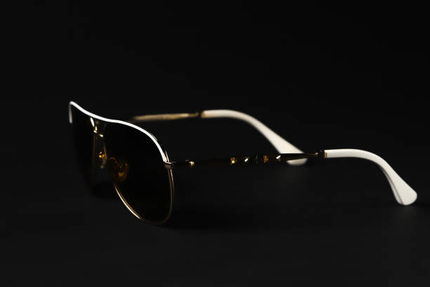 istock Black glasses with a classic frame on a dark background. Shallow depth of field 2045425879