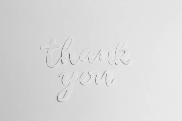 Thank you handwritten, on yellow paper, with a heart symbol