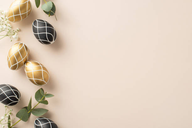 istock Sophisticated Easter motif: Overhead shot of exquisite eggs, organic eucalyptus foliage, subtle gypsophila petals, arranged neatly on light beige backdrop, providing space for message or promo 2045456083