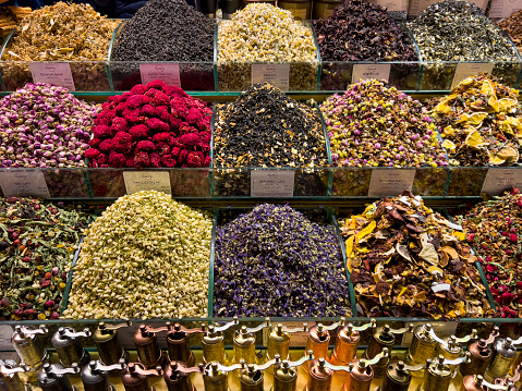 displays with different kinds of tea in a typical turkish store in the Spice bazaar or Egyptian bazaar in Istanbul, herbalist, herbal tea store, infusion mixture herbal floral fruit tea, horizontal