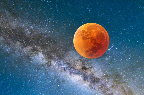 istock Landscape with Milky Way galaxy. night sky with stars and lunar eclipse. Blood Moon. 2045477217