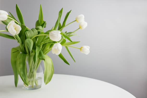 Beautiful flowers in vases in luxury interior
