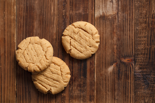 Delicious peanut butter cookies on rustic wood