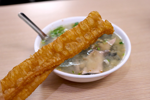 Fried bread stick, Youtiao, Chinese cruller. Taiwanese traditional famous and delicious street food in Taiwan, traditional cuisine in Taiwan. Close up of top view Chinese style food, usually can be founded in night market. Tainan, Taiwan.