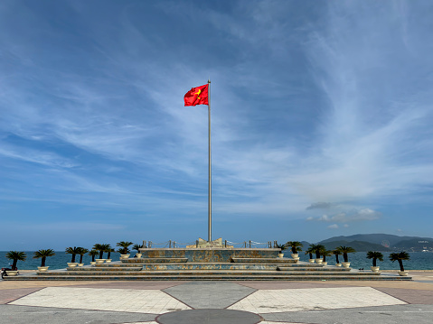The red flag of Vietnam on the beach of Nha Trang, Vietnam