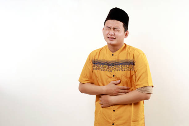 istock Young asian muslim man having problem with his stomach. Stomachache on ramadan month 2045513775