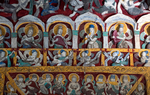 Jesus Christ with some of the saints and angels depicted on the spectacular reredos in the Minster church of St Margaret, King’s Lynn, in Norfolk, Eastern England. The saints seen here are St Jerome, St Gregory, St Augustine and St Ambrose and, creepily, all the figures appear to be looking straight at the viewer. The reredos was designed and installed by GF Bodley in 1899 during renovation by Sir George Gilbert Scott. The church dates from 1101AD and was founded by Herbert de Losinga, Bishop of Norwich.