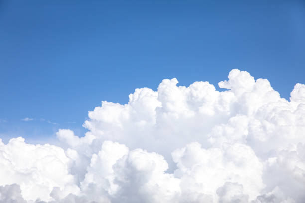 istock Huge white cumulus cloud against blue sky 2045527135