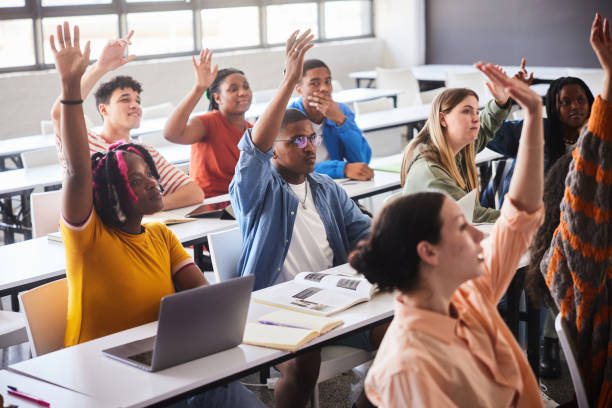 istock Group of diverse college students asking questions during a class at school 2045528792
