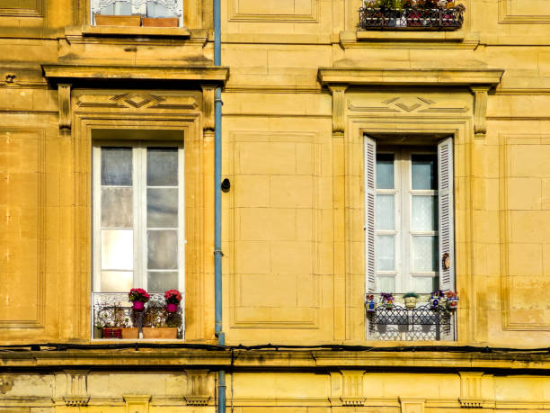 Architectural exterior details from narrow street of ancient city Arles in France