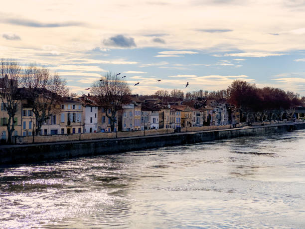 Houses in a row by Rhone river in ancient city Arles in France