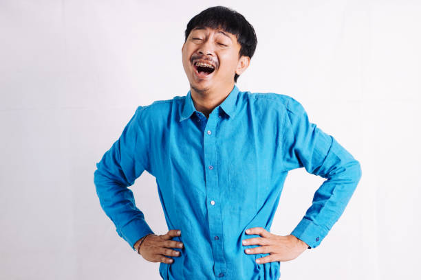 istock young man power pose. People emotions lifestyle concept. Mock up copy space. 2045534219