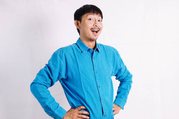 istock young man power pose. People emotions lifestyle concept. Mock up copy space. 2045534229