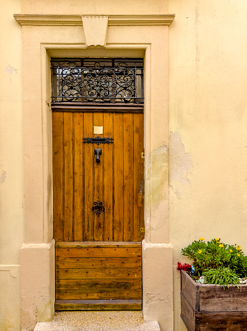 old wooden entrance door with antique door handle