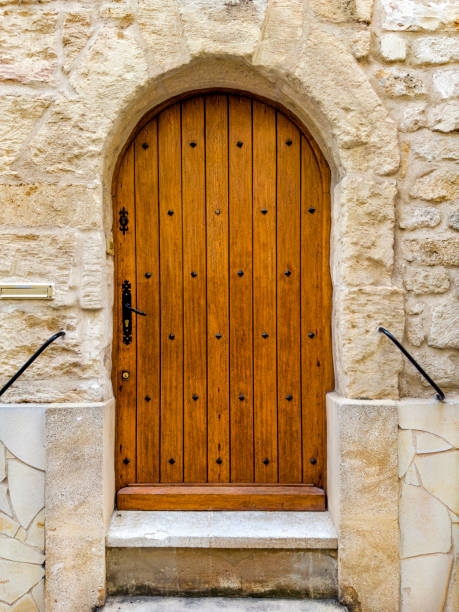 istock Retro style wooden brown front door close up 2045546920