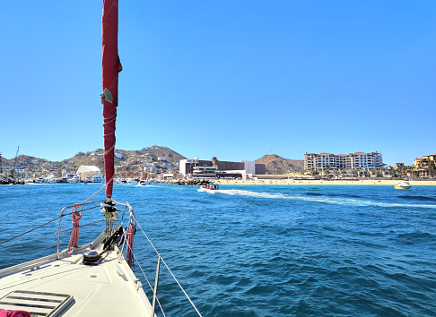 Sailing in Cabo San Lucas, point of union of the Pacific Ocean with the Sea of Cortés, Los Cabos, State of Baja California Sur, Mexico.