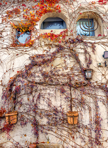 Architectural exterior details from narrow street of ancient city Arles in France