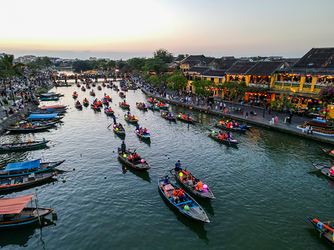 The lantern boats floating on the Thu Bun River at dusk time, Hoi An, Vietnam