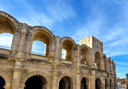 The Arles Amphitheatre is a Roman amphitheatre in Arles, southern France. Two-tiered, it is probably the most prominent tourist attraction in the city which thrived in Ancient Rome. Built in 90 AD, the amphitheatre held over 20,000 spectators.