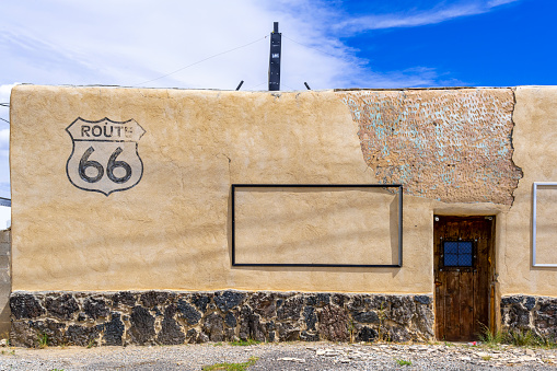 Laguna, New Mexico, United States - September 17, 2023: Route 66 sign painted on the wall of King's Cafe and Bar in Laguna, New Mexico.