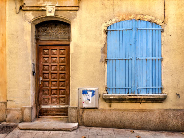Architectural exterior details from narrow street of ancient city Arles in France