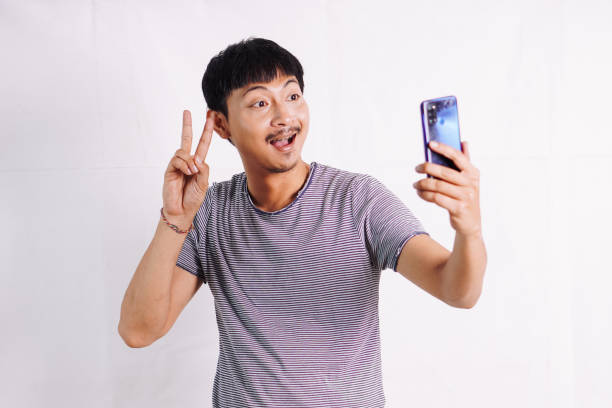 istock Asian show victory peace sign 2045562761