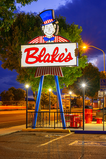 San Fidel, New Mexico, United States - September 18, 2023: Neon sign board of Blake's Restaurant in Grants, New Mexico, in evening light