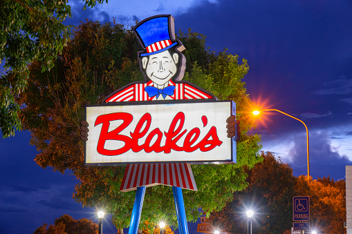 San Fidel, New Mexico, United States - September 18, 2023: Neon sign board of Blake's Restaurant in Grants, New Mexico, in evening light