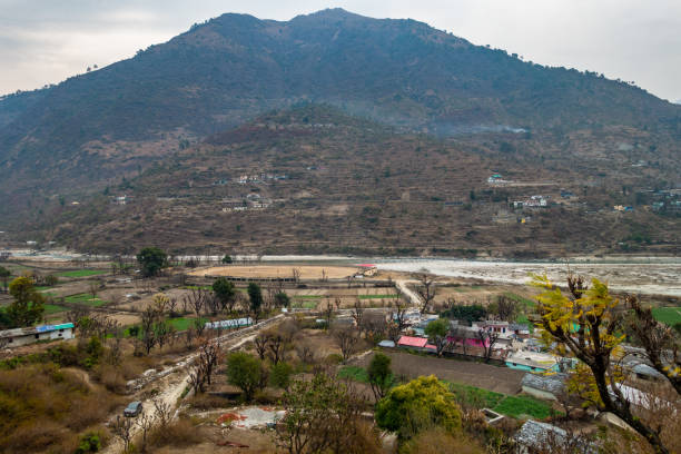 Cinematic Shot: Pyramid-Shaped Mountains with Riverside Village, Uttarkashi, Uttarakhand, India