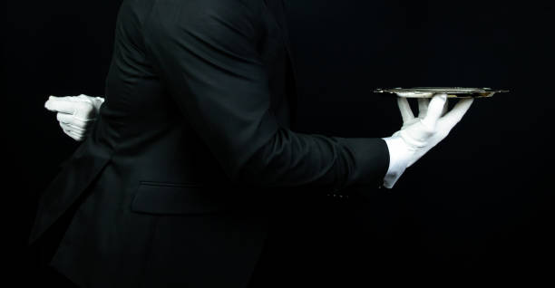 istock Formal Butler Holding Serving Tray 2045609573