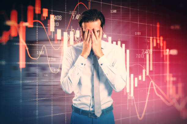 istock Stressed out businessman with falling red forex candlestick chart on blurry background. Global economic recession, stock market crash, inflation concept. 2045610626